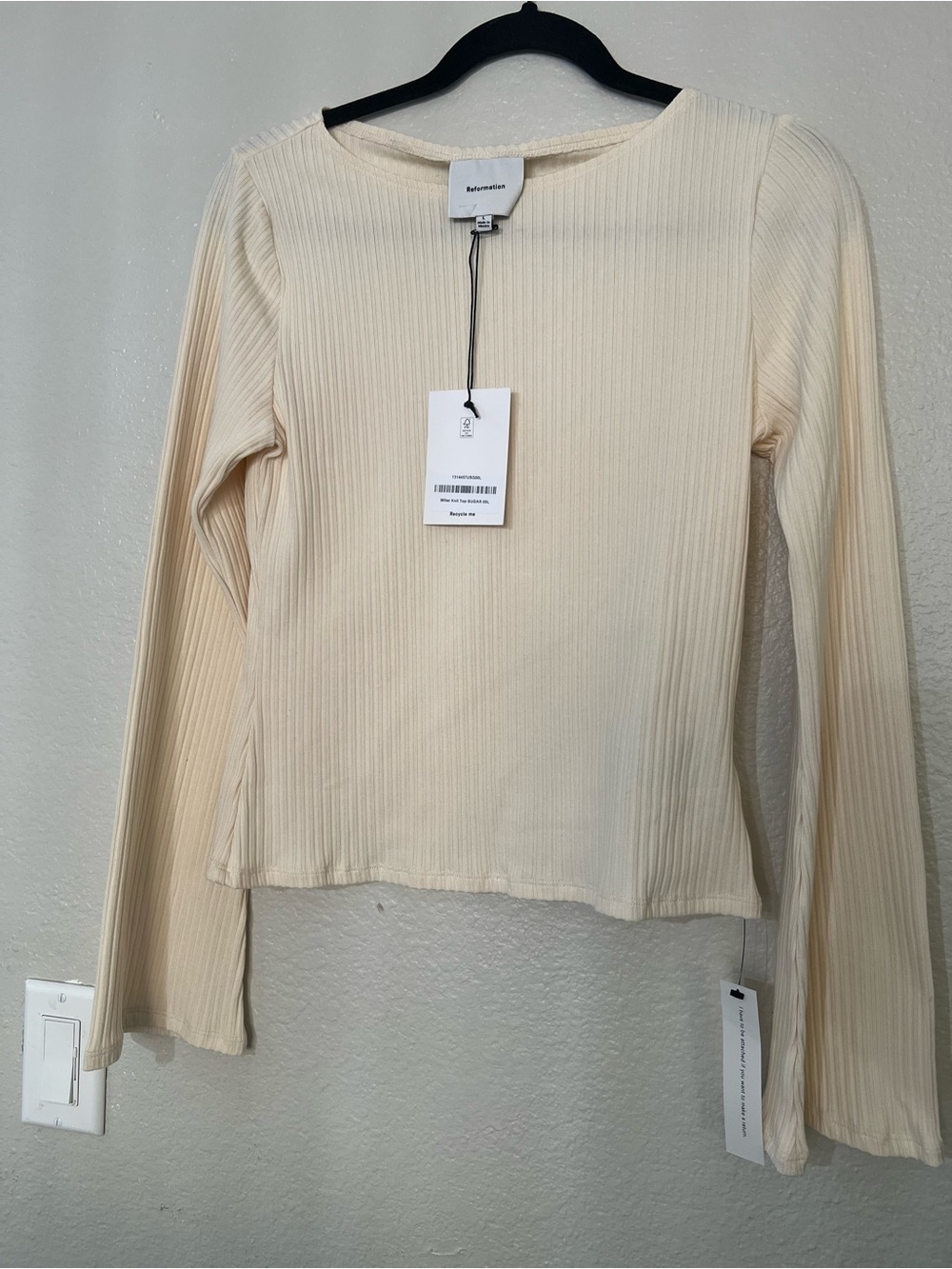 Reformation Cream Ribbed Long Sleeve Top with Boat Neck with subtle bell cuffs.